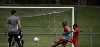 Dribbling past the defender and scoring